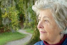 Older adult woman looking at a path